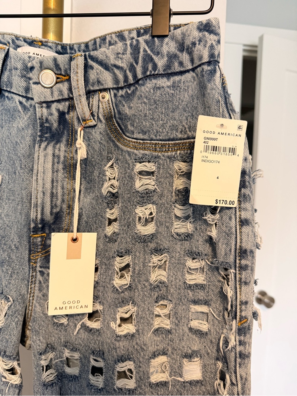 Good American Light Indigo High-Rise Distressed Jeans